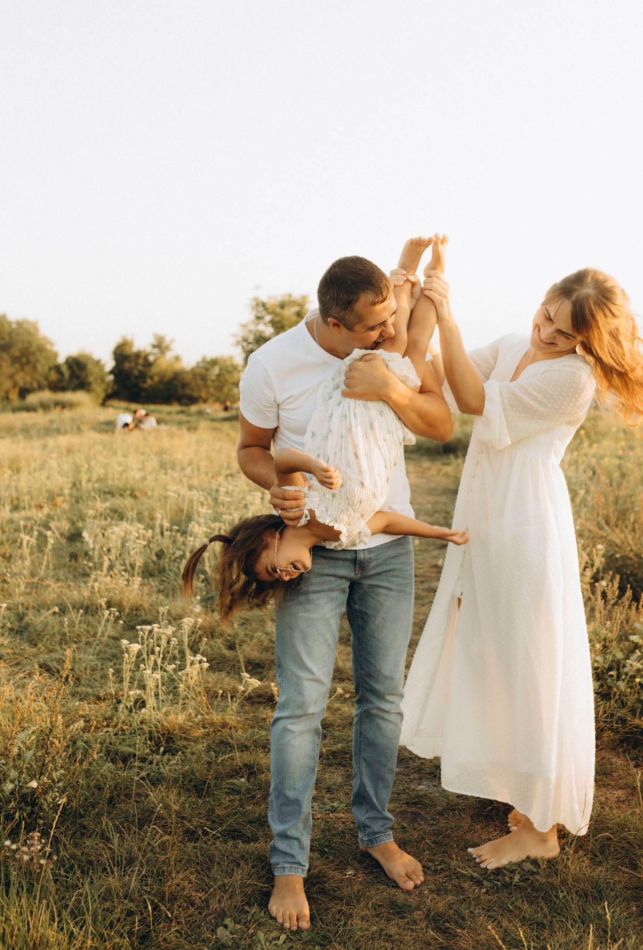A family sharing a playful moment outdoors